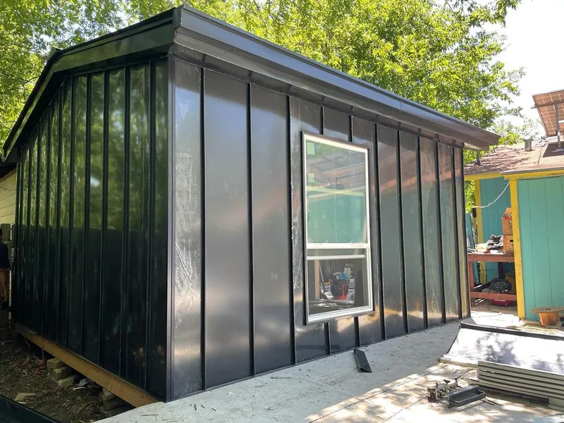 Black standing seam metal wall panels for Roof Inspection in Fergus Falls