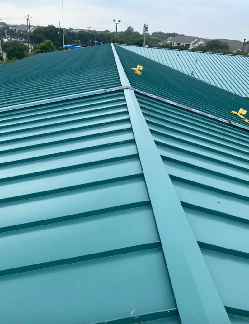 Green commercial metal roof ridge and valley for Metal Roof Repair in Fergus Falls